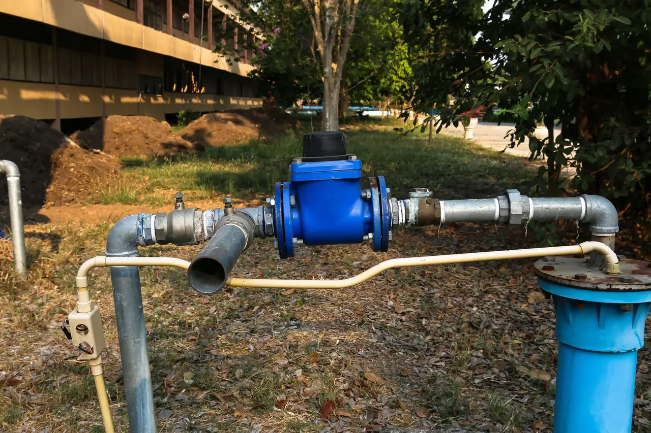 Well head with a blue water meter and galvanised piping — video preview