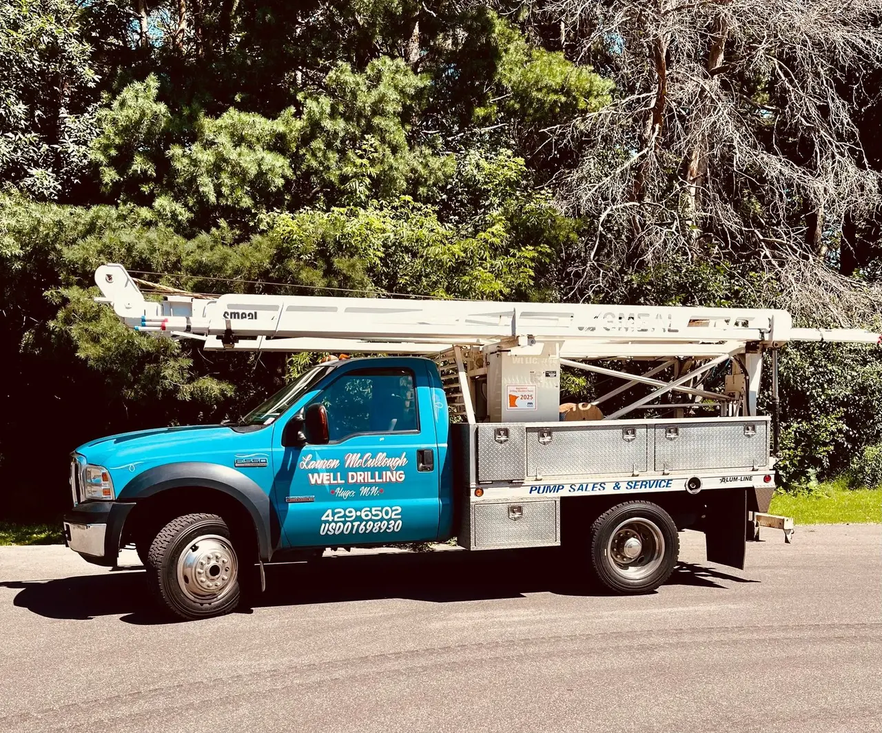 Lauren McCullough Pump Repair & Water Systems truck parked on a residential street